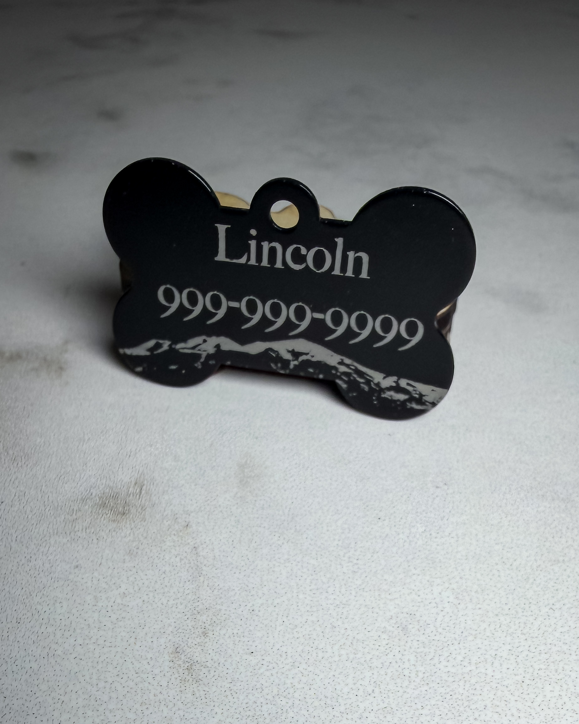 Custom engraved black metal dog tag